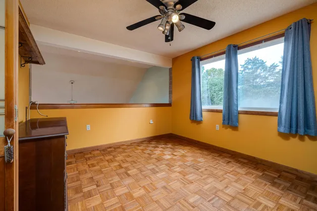 a balcony with furniture and a garden