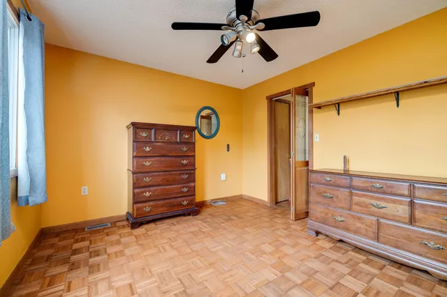 a view of a wooden house with a yard