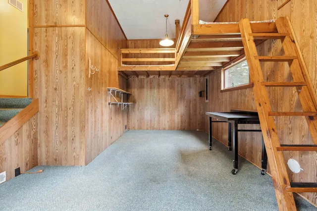 an aerial view of a house with yard swimming pool and outdoor seating