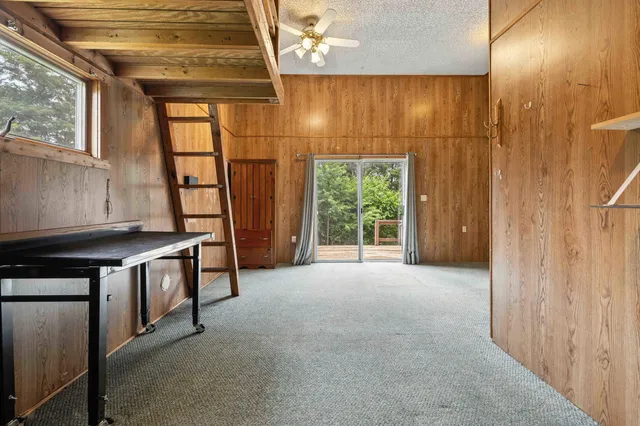 a view of a lake with huge green field
