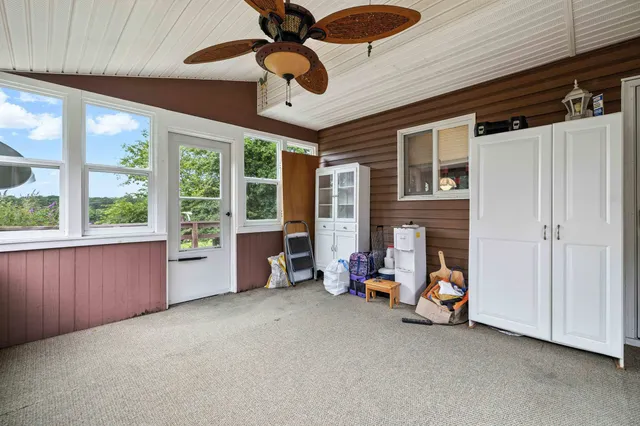 a front view of a house with plants