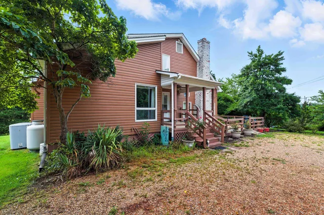 a view of a city with lush green forest