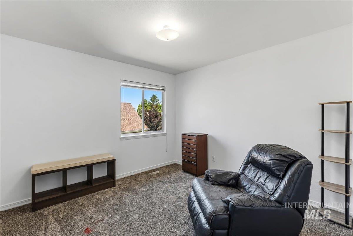 8001 West Innsbrook Court Boise, ID 83704 - Photo 31 of 39 Room with neutral wall paint and carpet flooring
