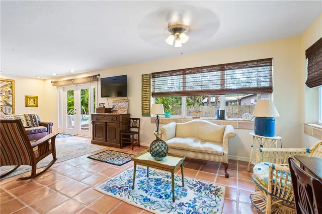 a living room with furniture fireplace and a flat screen tv
