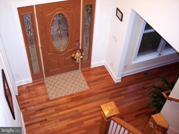 93 Tom Jenkins Road Fredericksburg, VA 22406 - Photo 7 of 13 2-story foyer with side double paneled door