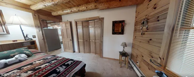 a living room with lots of furniture and a chandelier