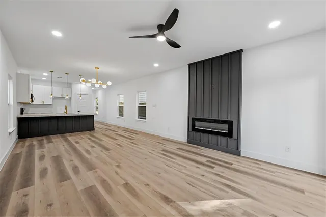 a view of kitchen and empty room