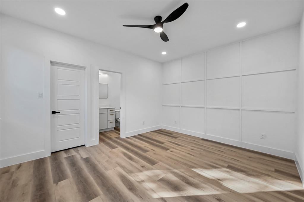 2413 Easley Street Dallas, TX 75215 - Photo 16 of 24 an empty room with a ceiling fan and carpet