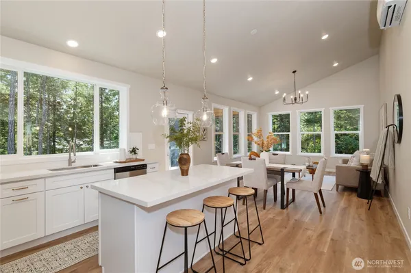 a view of a dining room with furniture window and outside view
