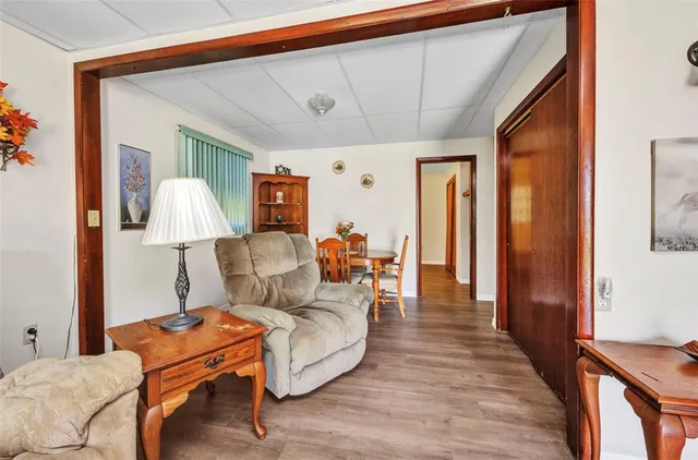 a living room with furniture and a lamp