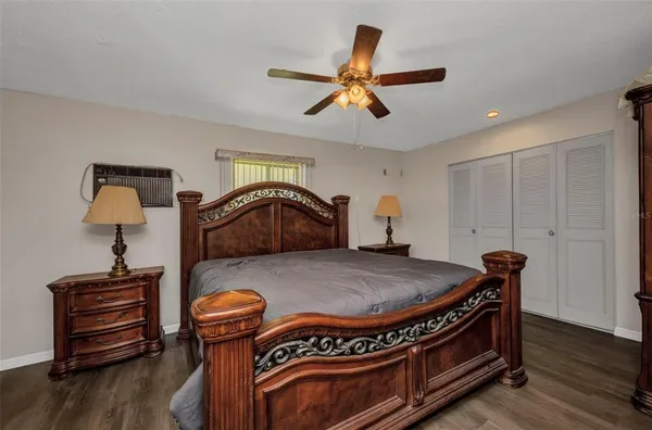 a bed room with a bed and a dresser