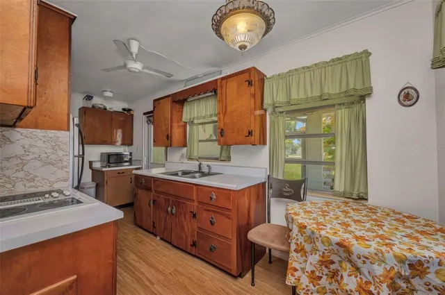 a kitchen with a stove and a refrigerator