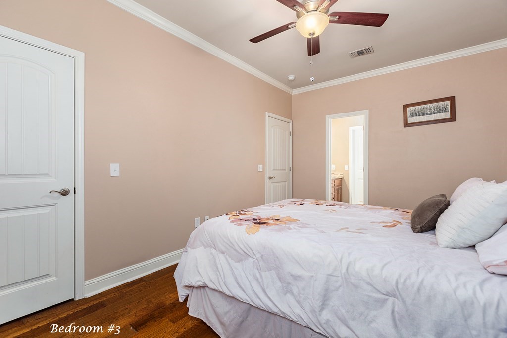 1171 Old Ewing Road Lufkin, TX 75901 - Photo 21 of 49 a bedroom with a large bed chandelier and a window