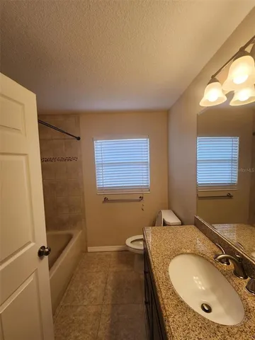 a view of sitting area with furniture and wooden floor