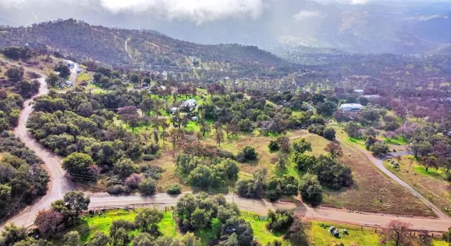 an aerial view of residential house and outdoor space