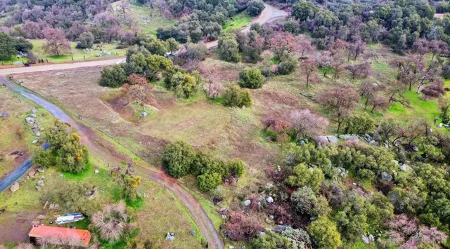 an aerial view of residential house and outdoor space