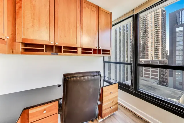a view of a floor to ceiling window with wooden floor