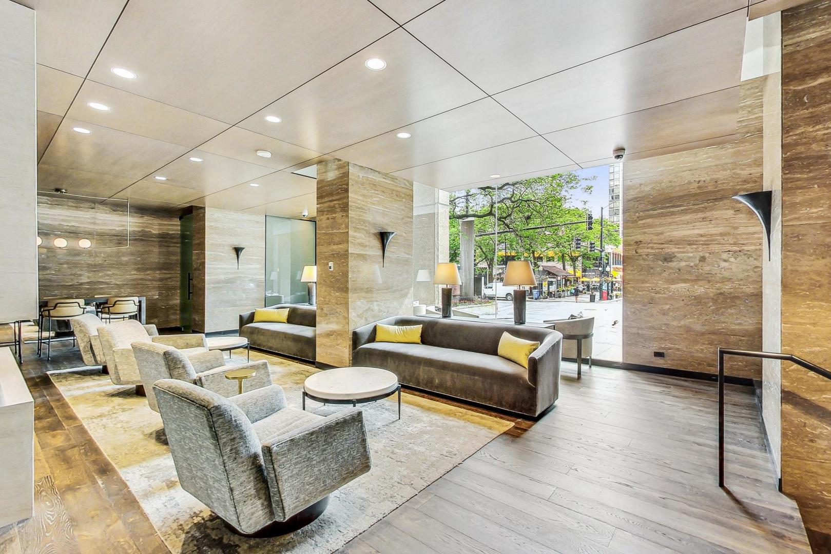 1030 North State Street, Unit 5B Chicago, IL 60610 - Photo 3 of 36 a living room with furniture and a large window