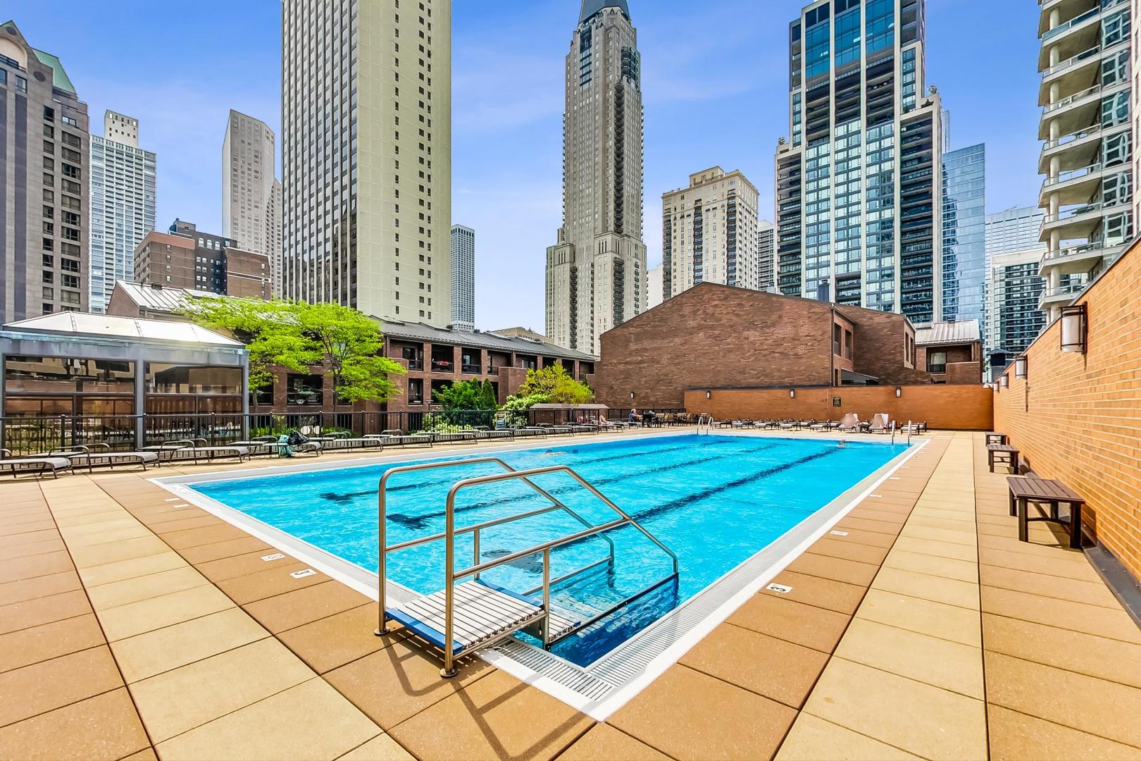 1030 North State Street, Unit 5B Chicago, IL 60610 - Photo 33 of 36 a view of a swimming pool with a lounge chairs