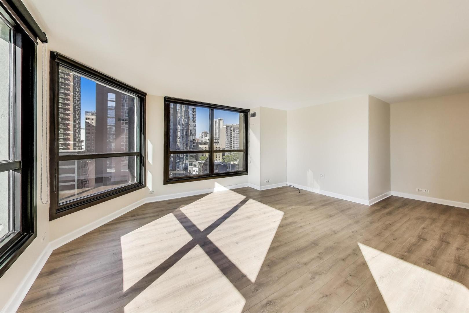 1030 North State Street, Unit 5B Chicago, IL 60610 - Photo 8 of 36 an empty room with large windows