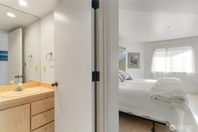 a en suite bathroom with a sink and mirror