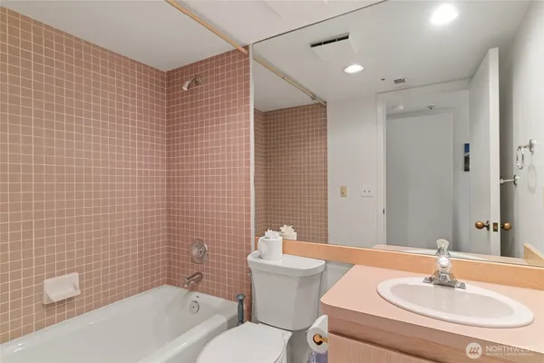 a en suite bathroom with a sink and mirror