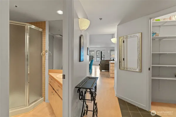 a living room with a couch and a walk in closet