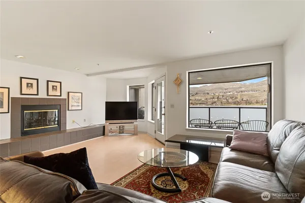 a living room with furniture and a rug
