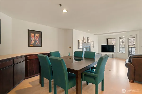 a kitchen with kitchen island a appliances dining table and chairs