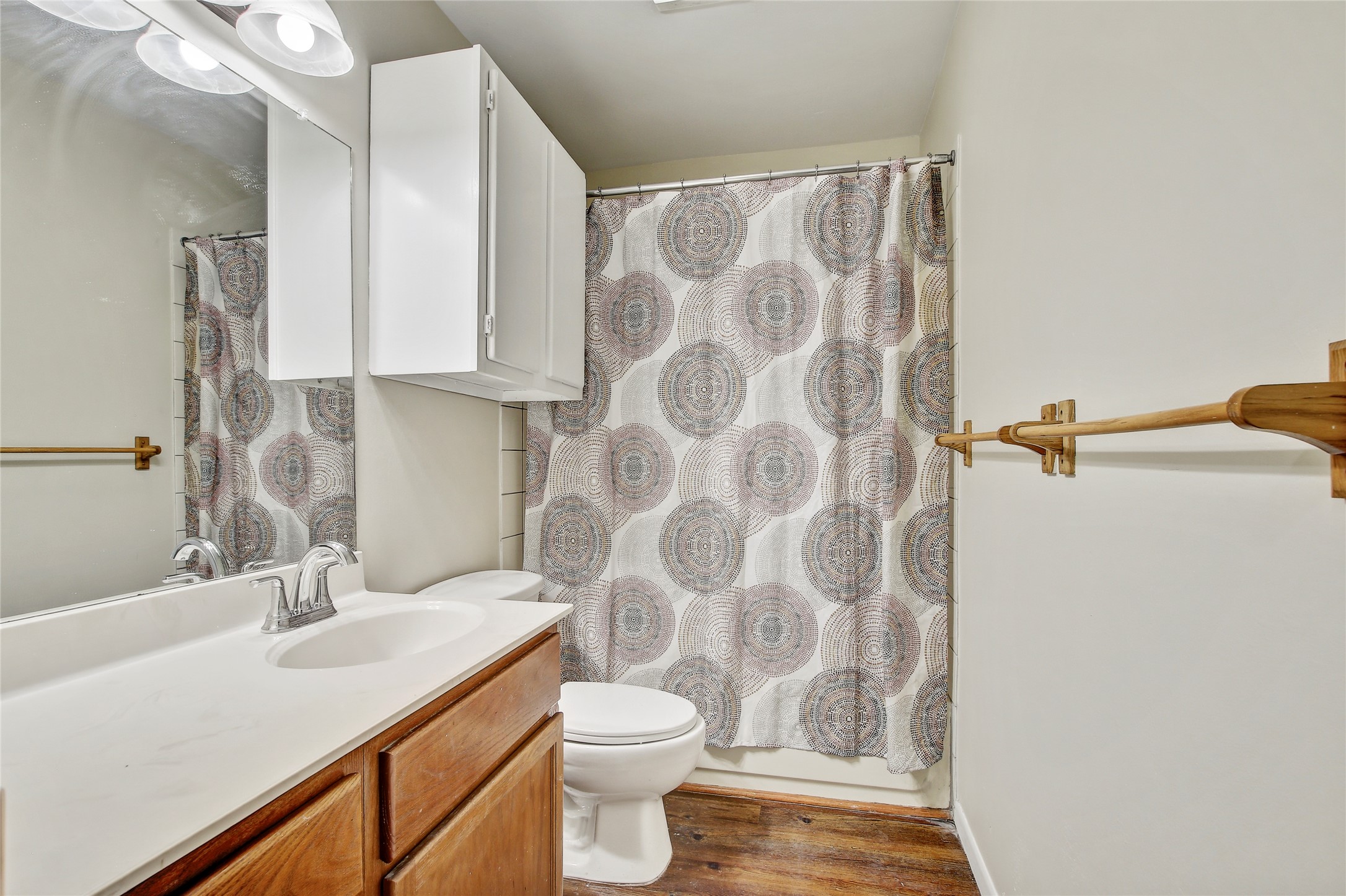 6902 Rifle Bend, Unit B Austin, TX 78736 - Photo 13 of 34 a bathroom with a sink and a toilet