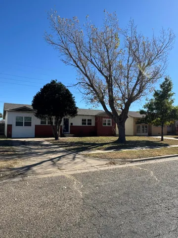 a view of a trees in front of a house