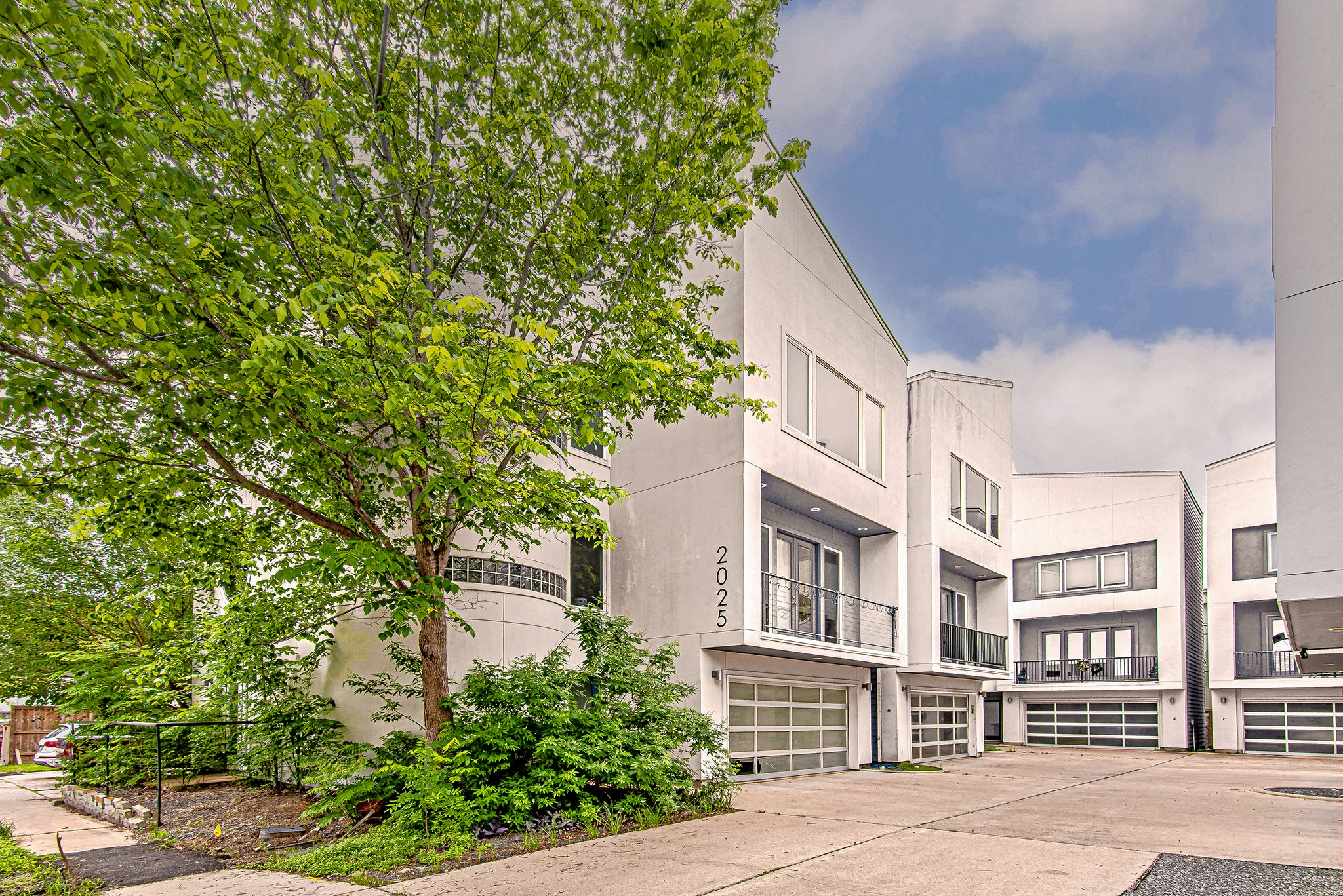 2025 Colquitt Street, Unit E Houston, TX 77098 - Photo 29 of 29 Contemporary exterior showcasing sleek finishes and expansive windows.