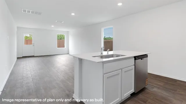 a kitchen with stainless steel appliances granite countertop a stove and a microwave