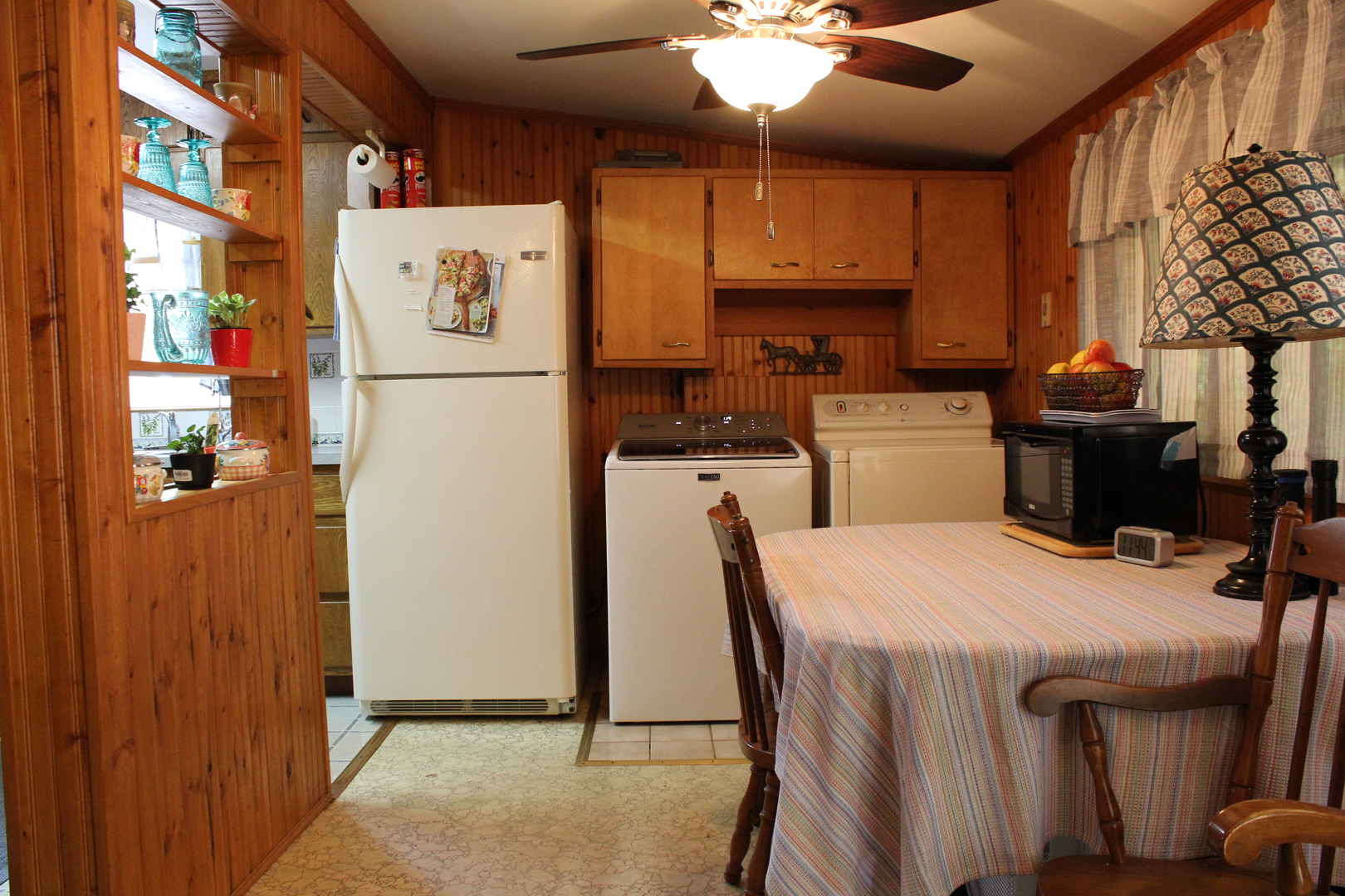 8409 Balder Drive Cary, IL 60013 - Photo 14 of 23 a kitchen with stainless steel appliances granite countertop a refrigerator a sink dishwasher a stove with white cabinets and wooden floor