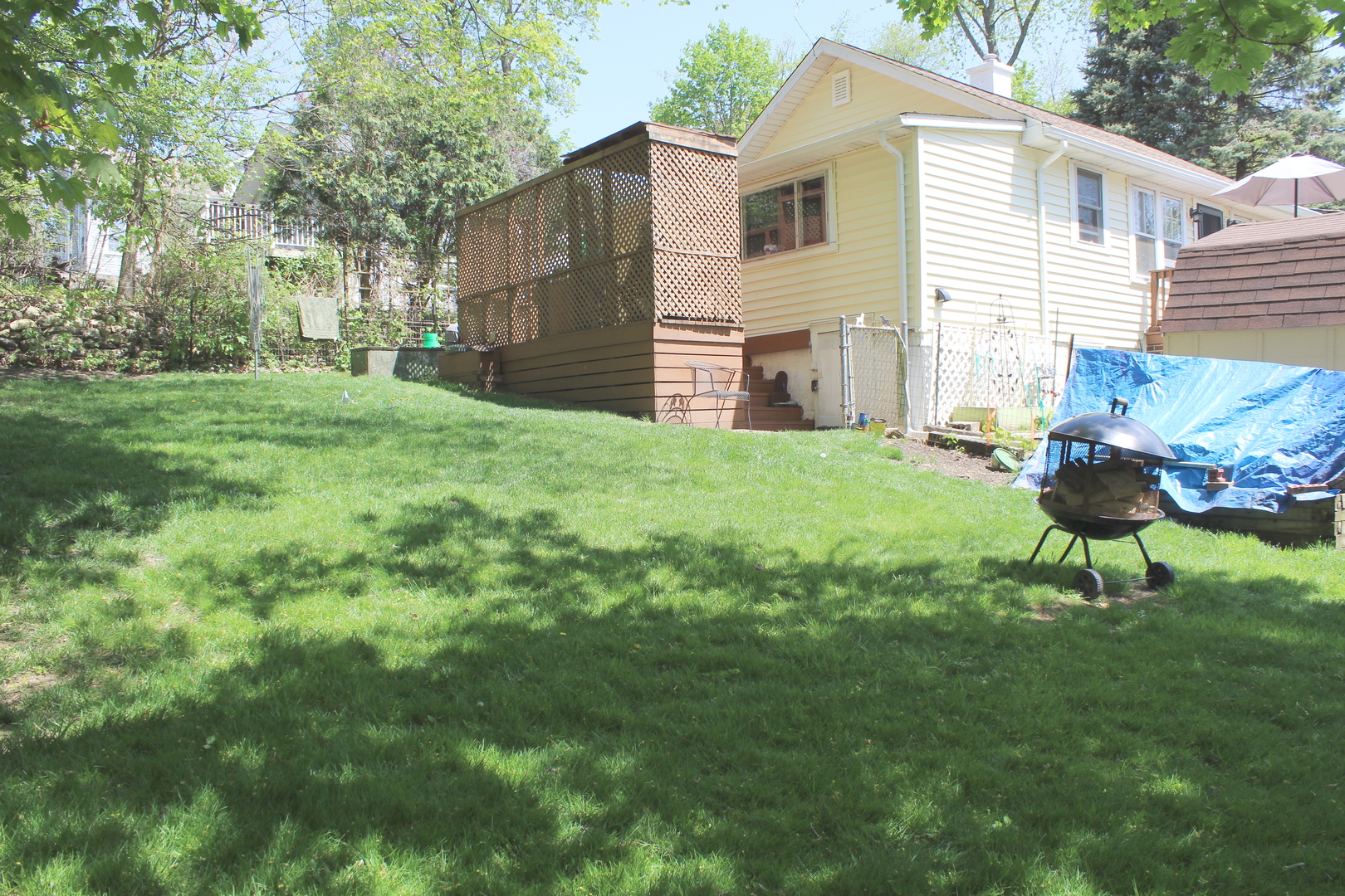 8409 Balder Drive Cary, IL 60013 - Photo 19 of 23 a backyard of a house with table and chairs