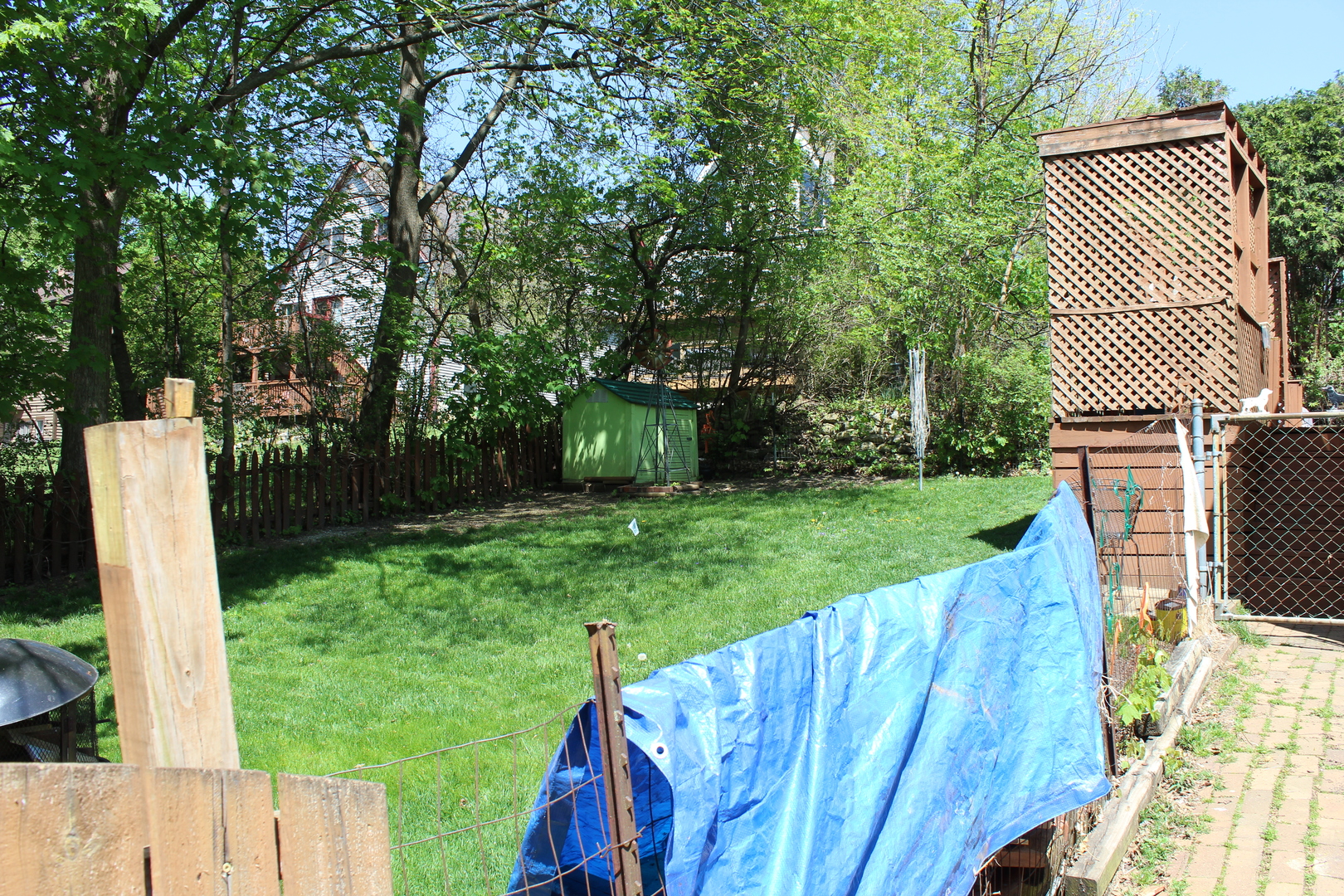 8409 Balder Drive Cary, IL 60013 - Photo 21 of 23 a view of a backyard with wooden fence and a bench