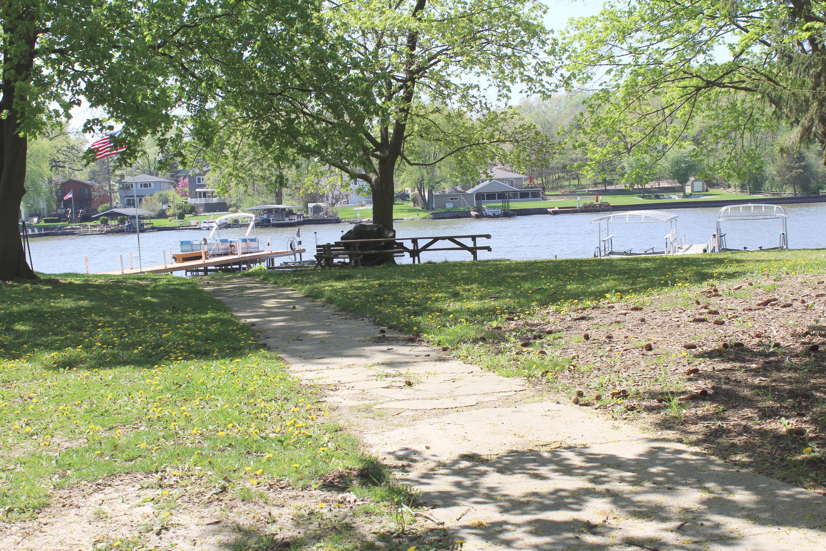 8409 Balder Drive Cary, IL 60013 - Photo 22 of 23 a view of swimming pool with a yard and large trees