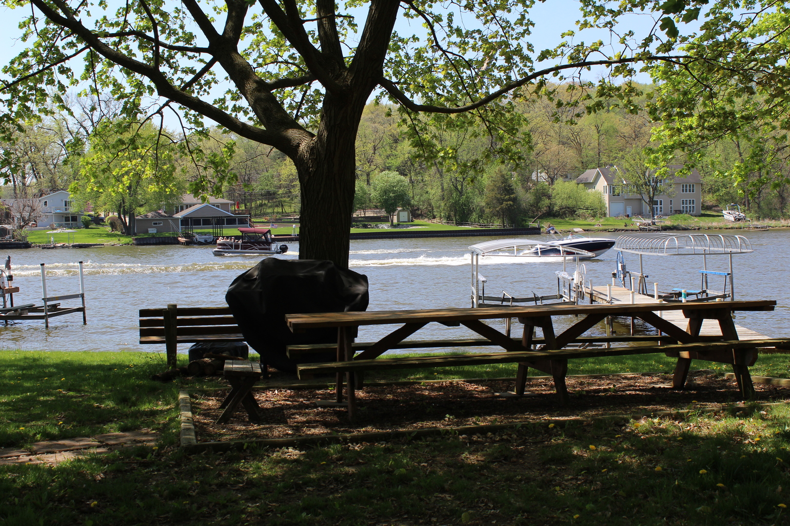 8409 Balder Drive Cary, IL 60013 - Photo 23 of 23 a view of a chairs and table in backyard
