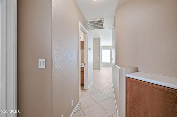 a view of a hallway with bathroom