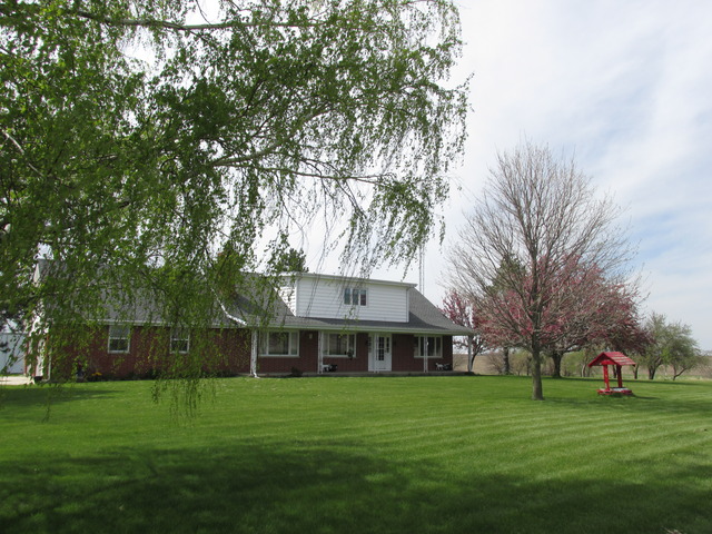 1521 Paw Paw Road Lee, IL 60530 - Photo 1 of 1 a front view of a house with a garden
