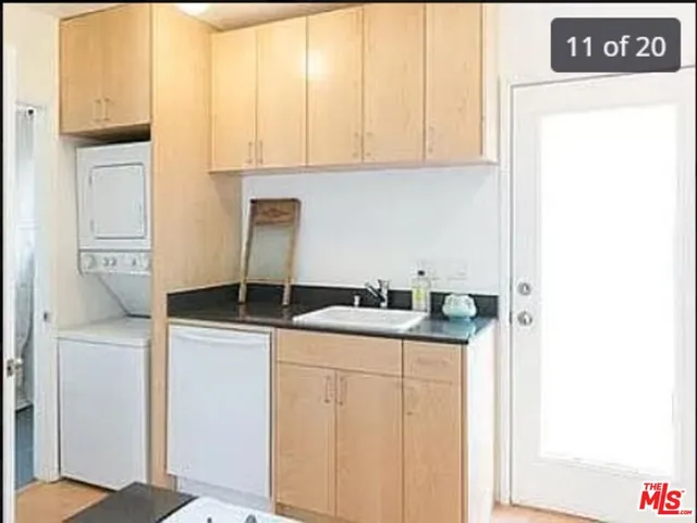 a living room with furniture a rug and a window