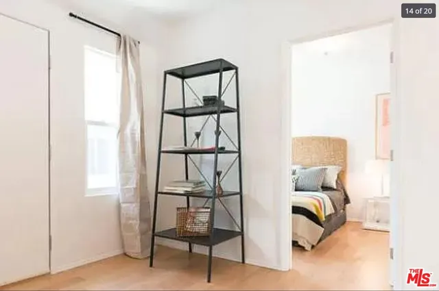 a living room with furniture rug and wooden floor
