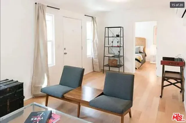 a view of a dinning table and chairs in a patio