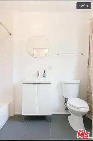 a living room with furniture a window and a table