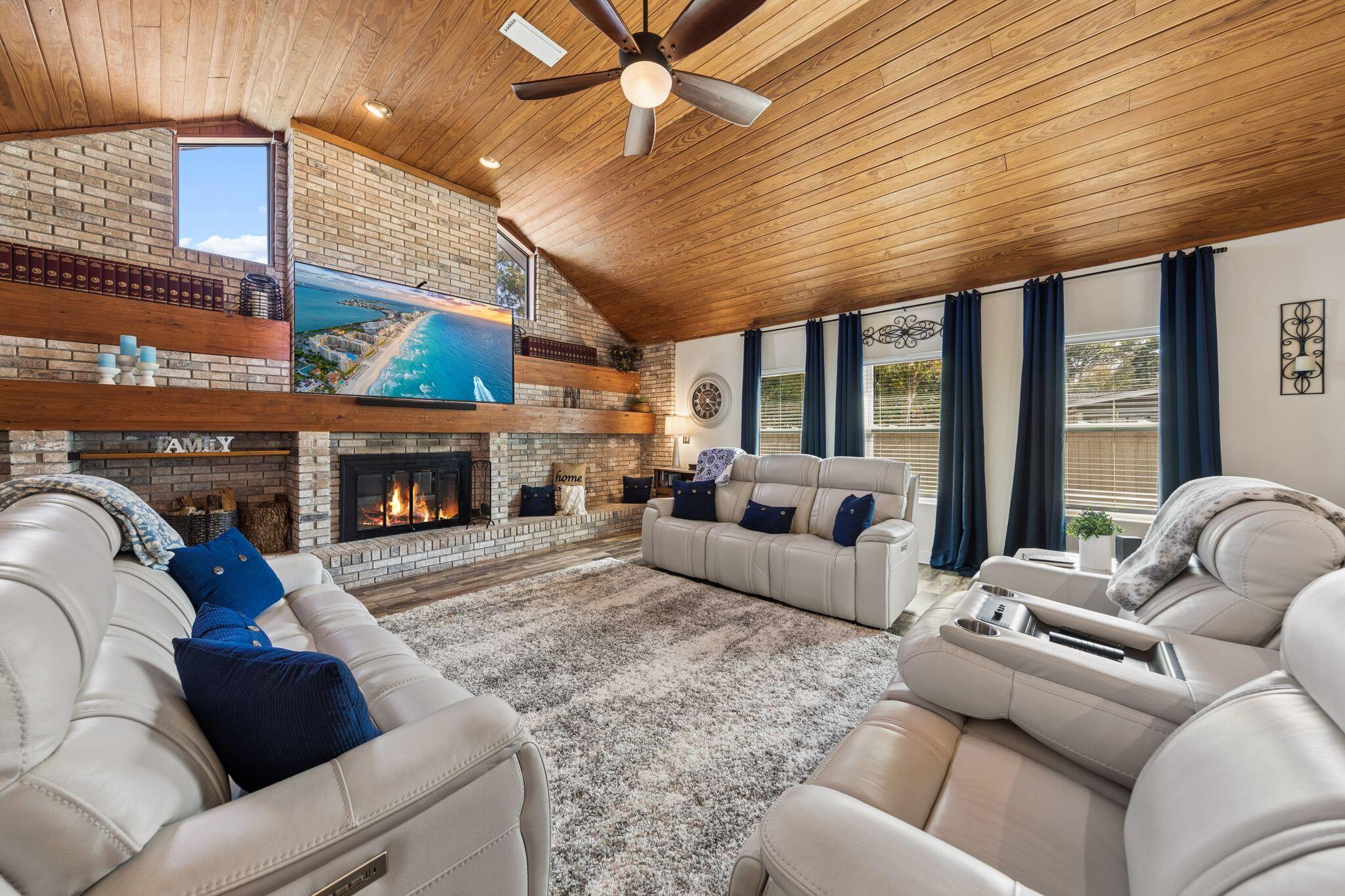 11 Hampton Circle Niceville, FL 32578 - Photo 21 of 79 a living room with furniture fireplace and a large window