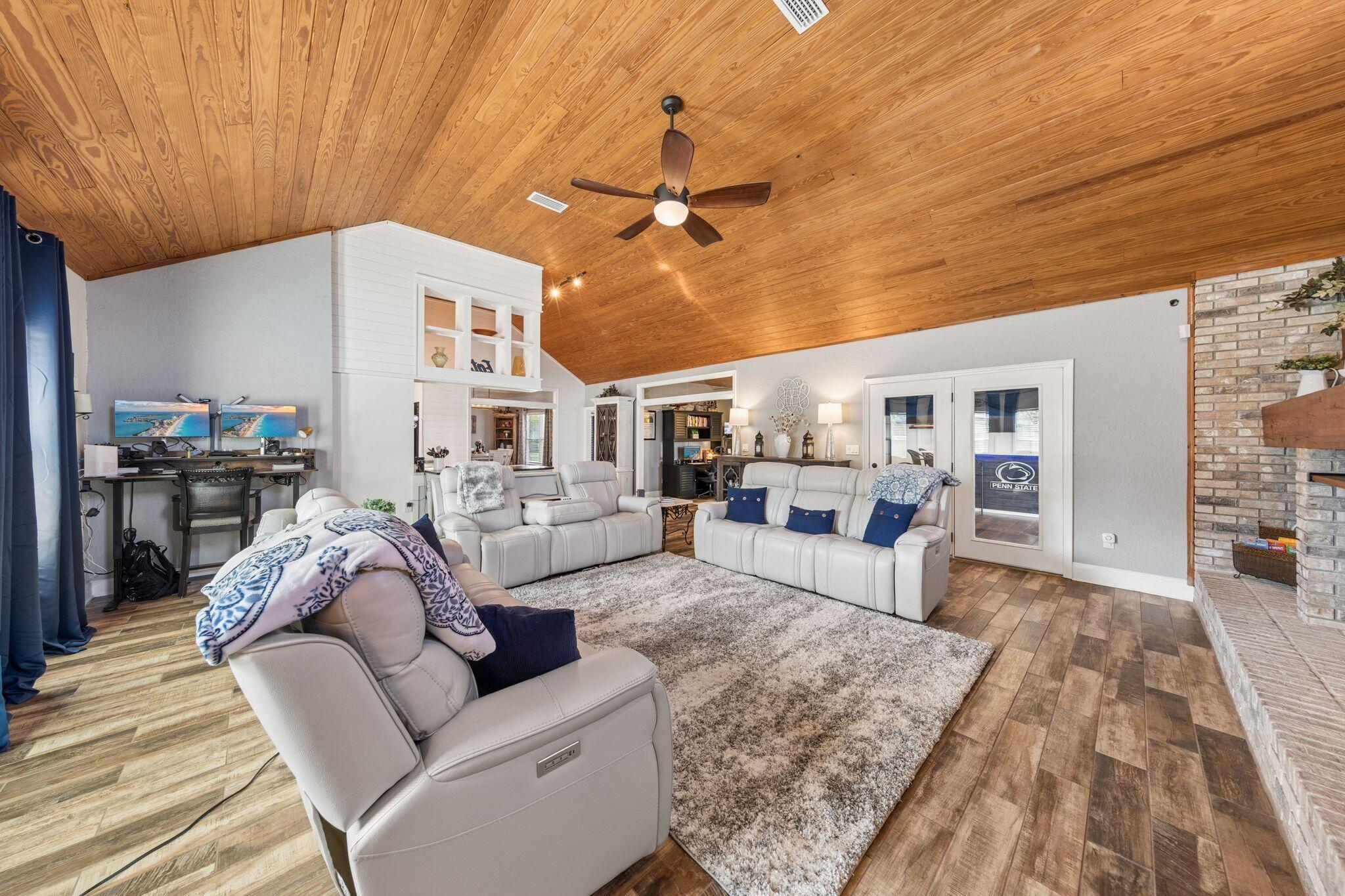 11 Hampton Circle Niceville, FL 32578 - Photo 22 of 79 a living room with furniture and a fireplace