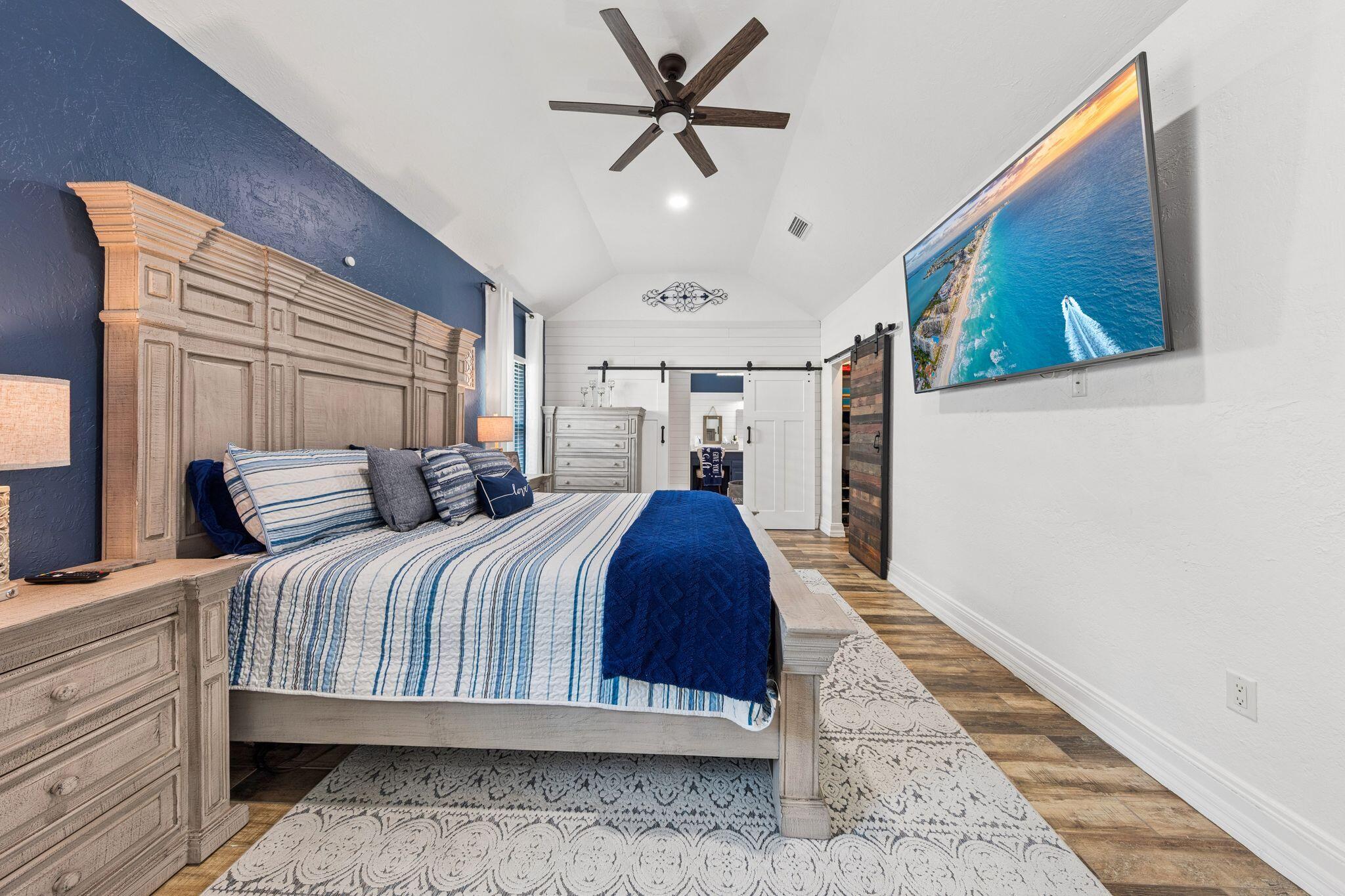 11 Hampton Circle Niceville, FL 32578 - Photo 27 of 79 a bedroom with a large bed and a chandelier