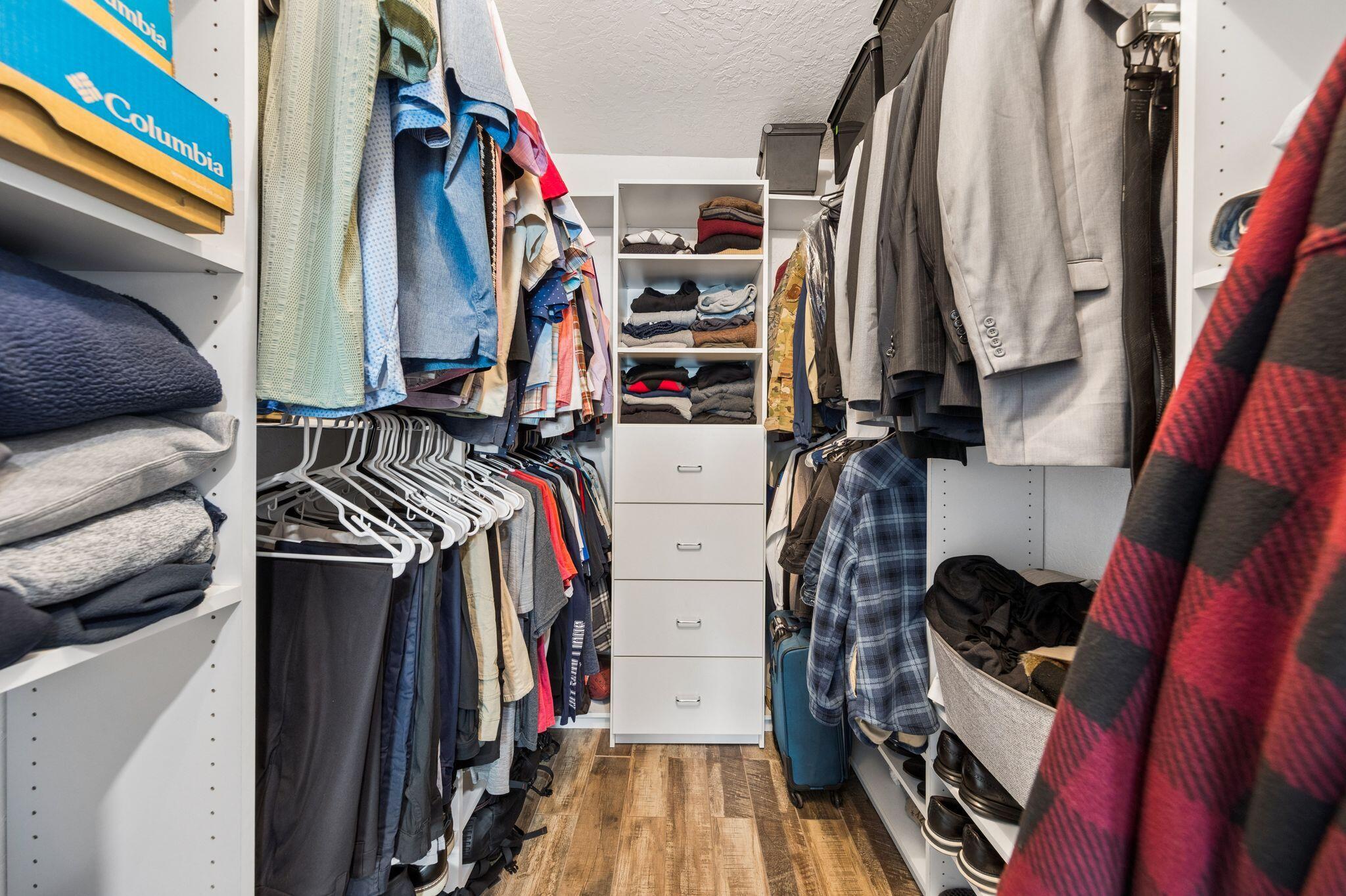 11 Hampton Circle Niceville, FL 32578 - Photo 29 of 79 a view of walk in closet with clothes and shoes