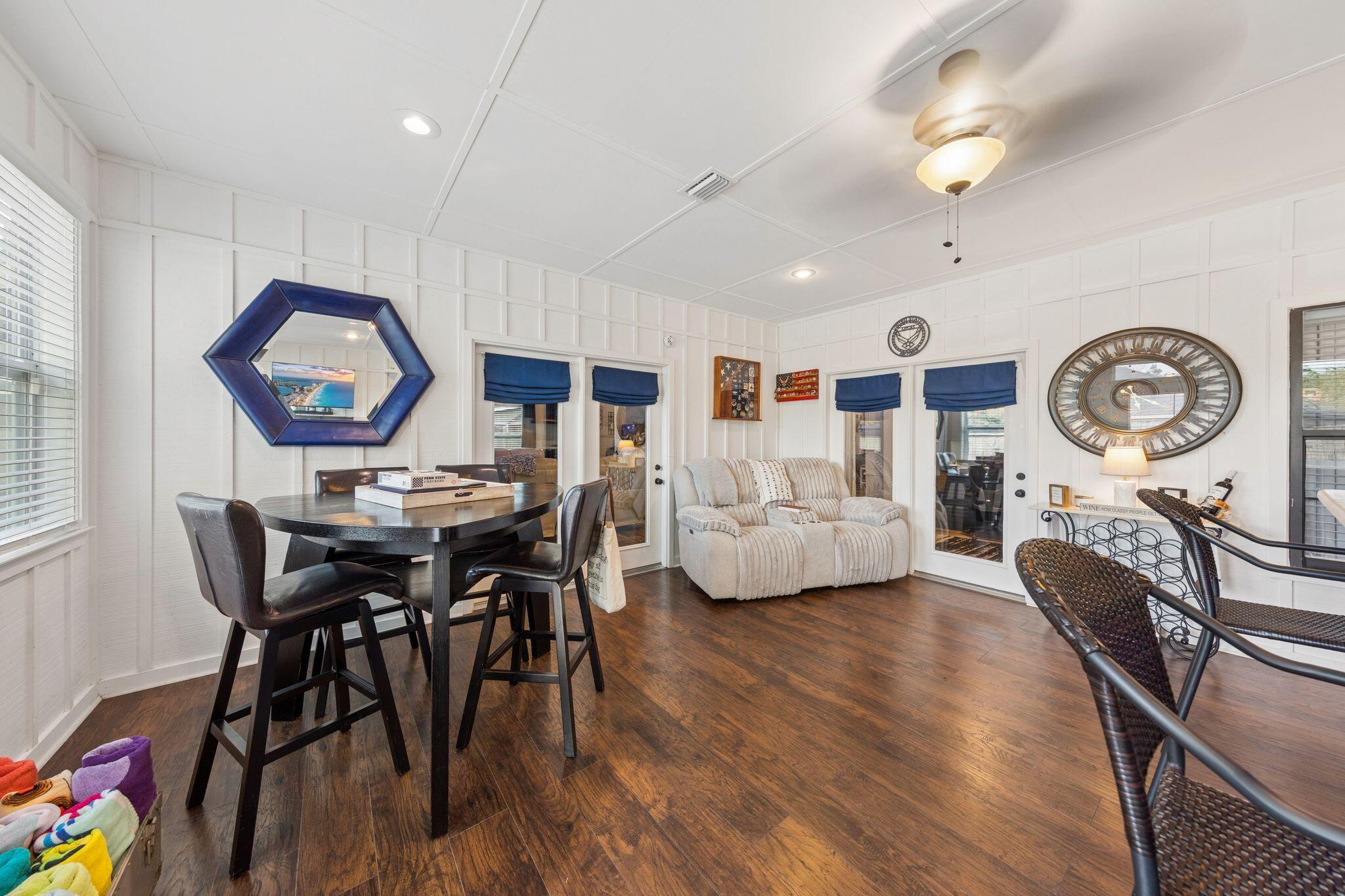 11 Hampton Circle Niceville, FL 32578 - Photo 39 of 79 a living room with furniture a clock on wall and a window