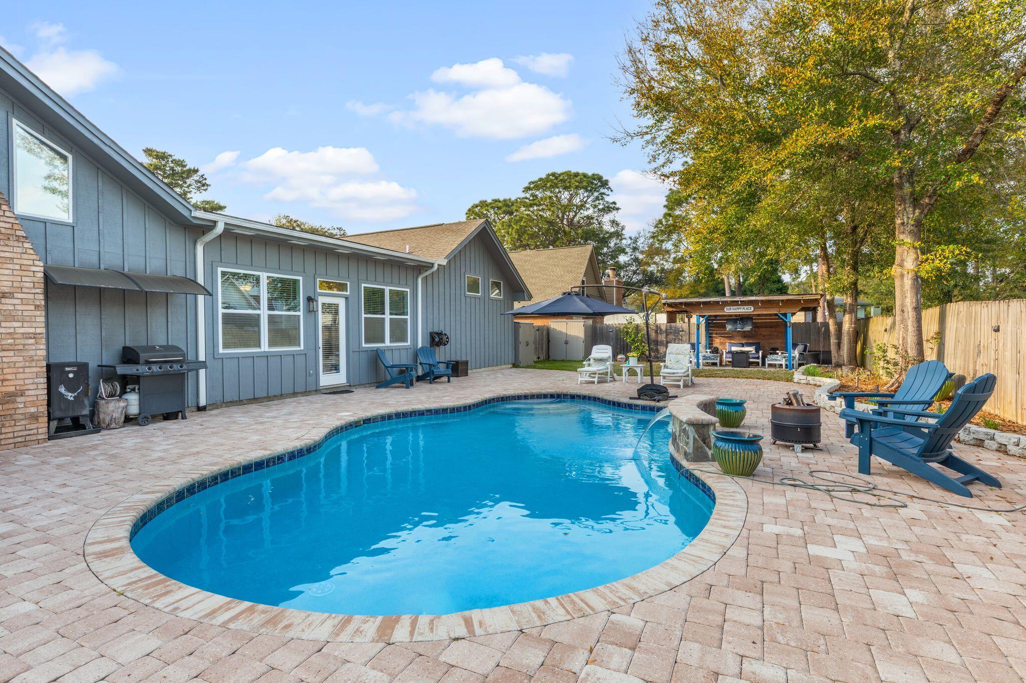 11 Hampton Circle Niceville, FL 32578 - Photo 57 of 79 a view of a house with swimming pool and sitting area